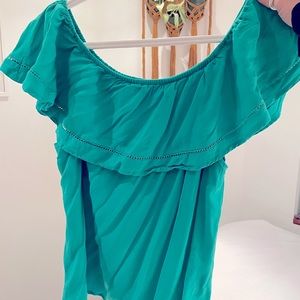 Turquoise Woman’s Off The Shoulder Shirt